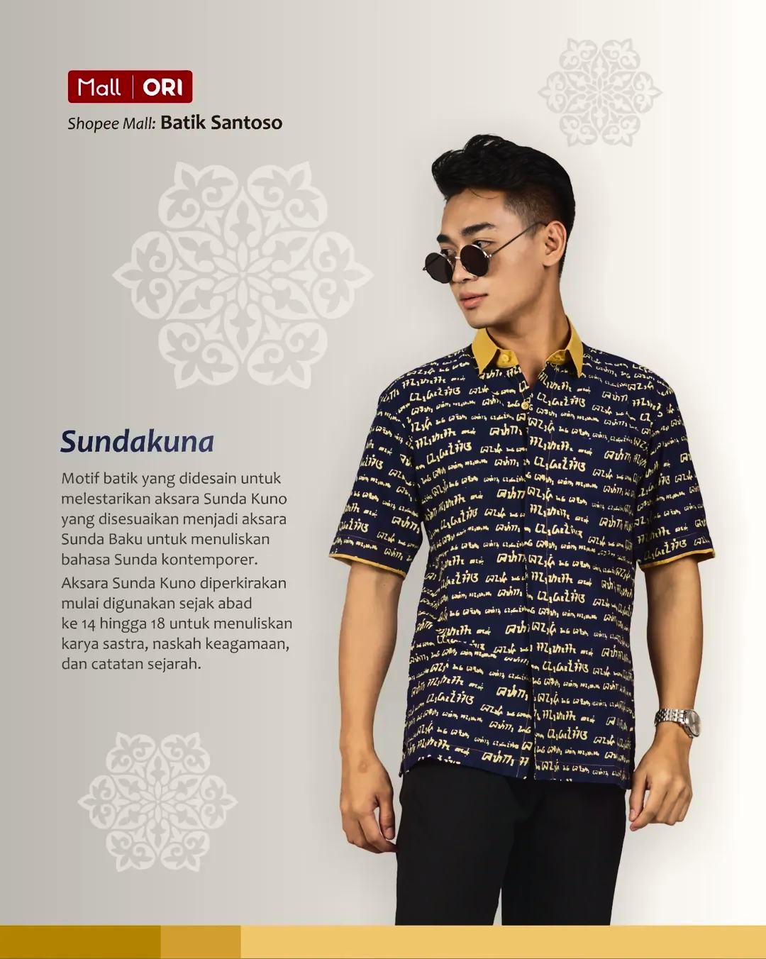 Model mengenakan kemeja batik navy motif kaligrafi